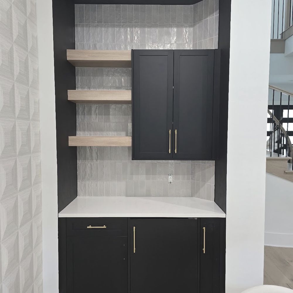 Custom black built-in with floating shelves by Renovari