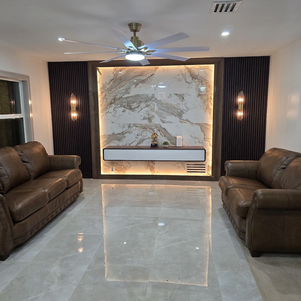 Custom media wall with wood slat panels by Renovari