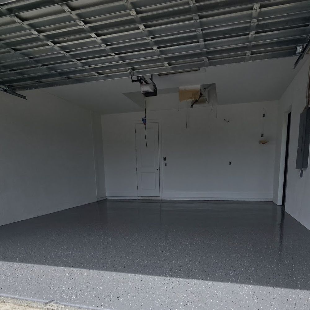 Gray flake epoxy garage floor installed by Renovari