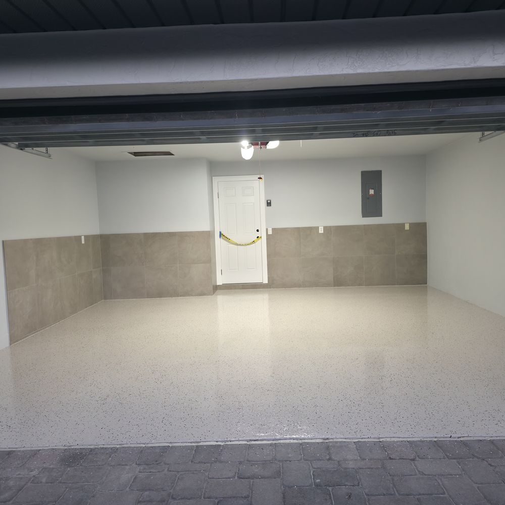 Light flake epoxy garage floor installed by Renovari