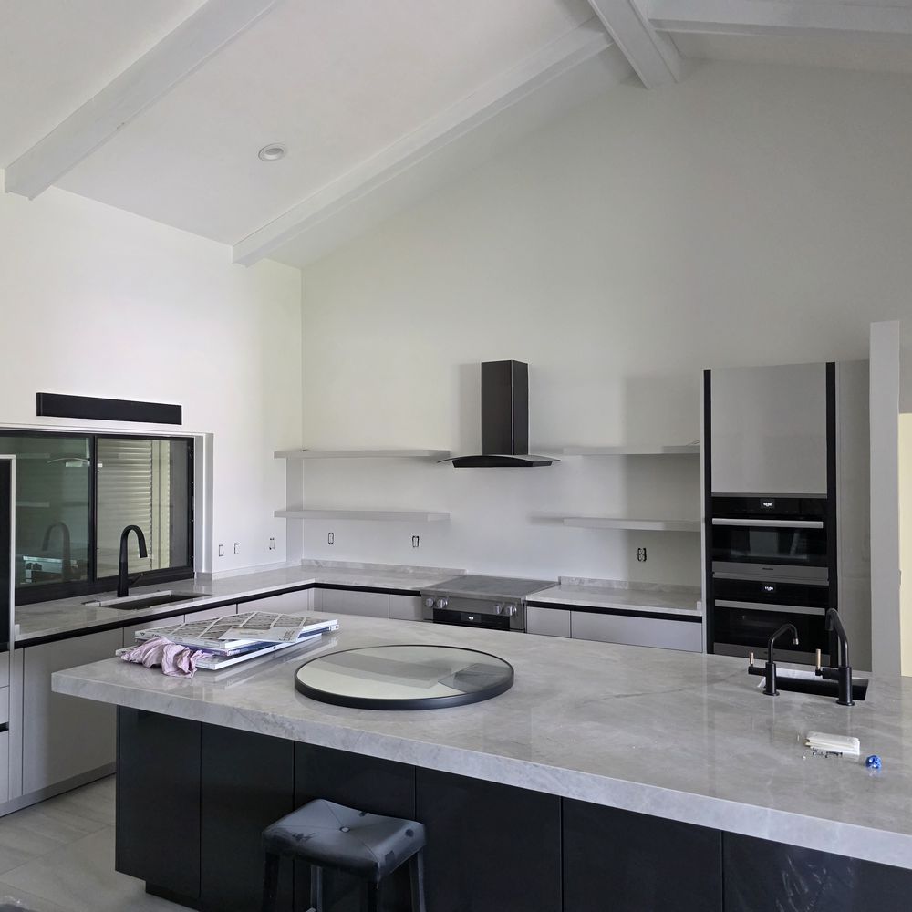 Open kitchen and living area painted by Renovari