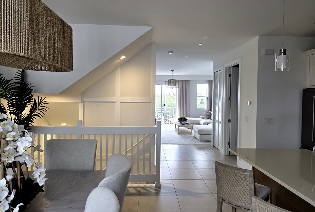 Open dining and living area with freshly painted walls and ceilings by Renovari